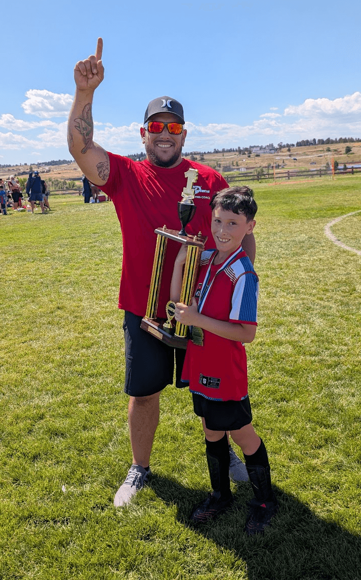 Codee Jessen coaching soccer with his son